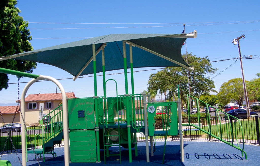 Playground play structure with a shade canopy